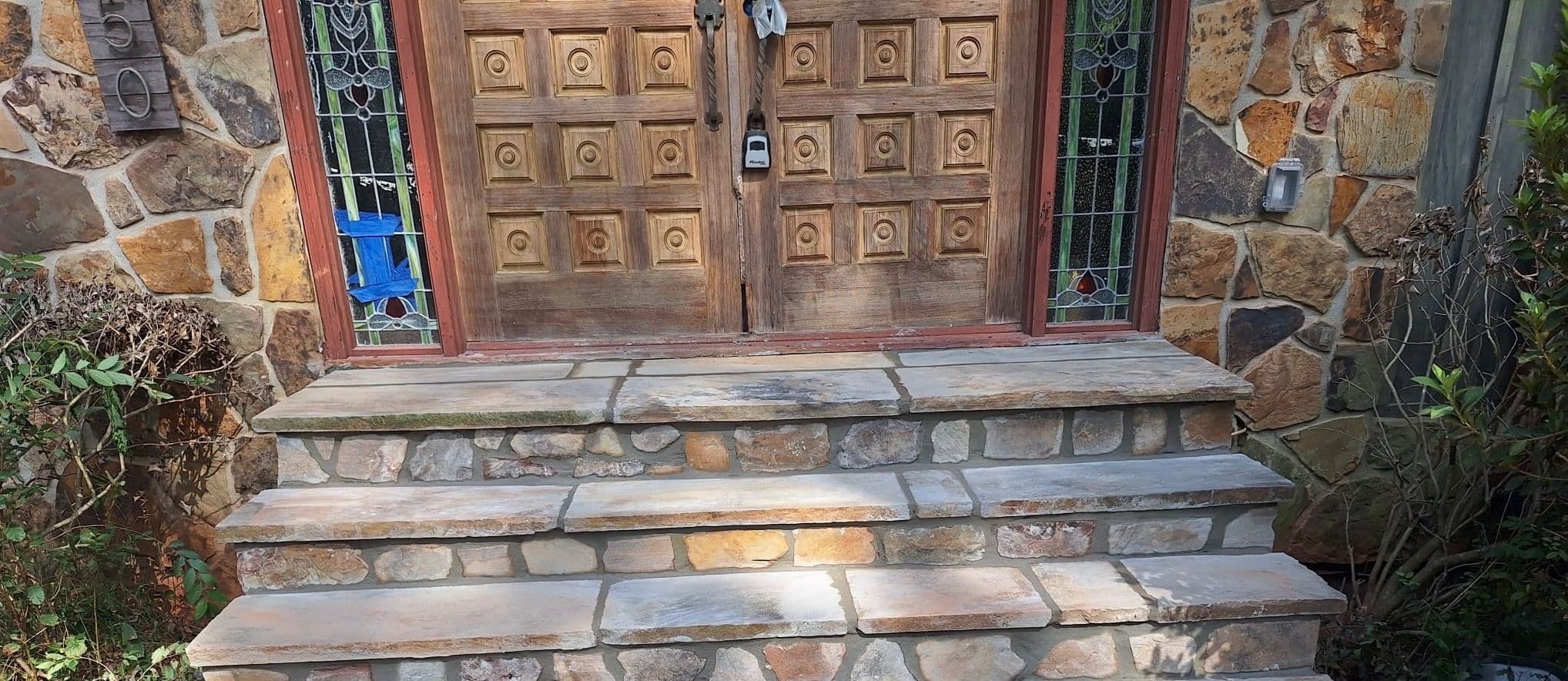 Project Rustic Stone Entrance Enhances Home Aesthetic image